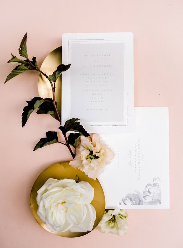 Elegant wedding invitation suite with floral accents and gold details, perfect for a sophisticated Winnipeg wedding or event. Beautifully styled with roses and soft pastel tones.