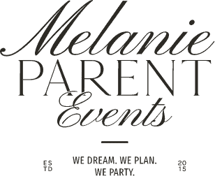 Elegant wedding reception setup with floral centerpieces and soft lighting at Melanie Parent Events in Winnipeg.
